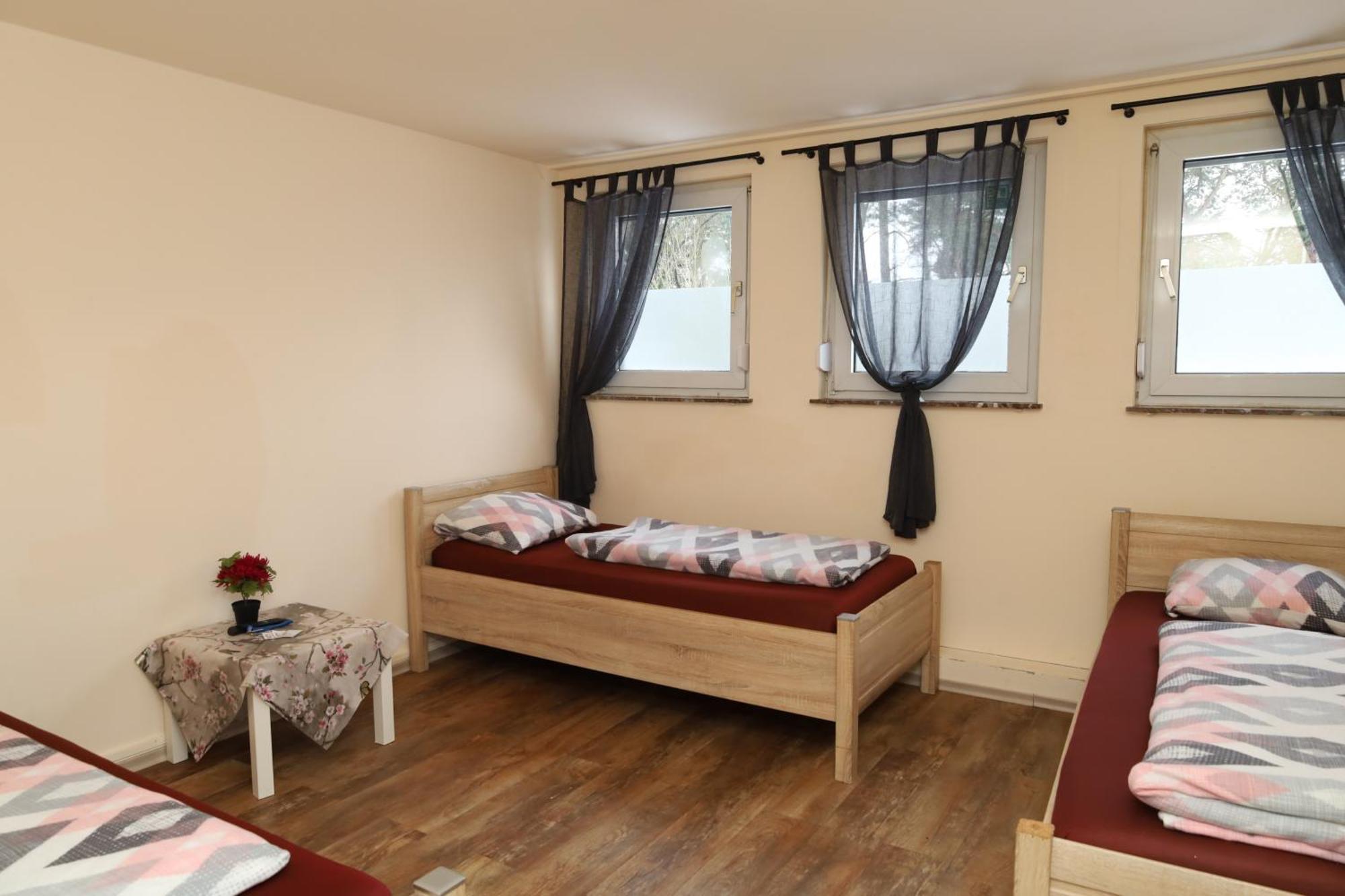 Dreibettzimmer mit Gemeinschaftsbad